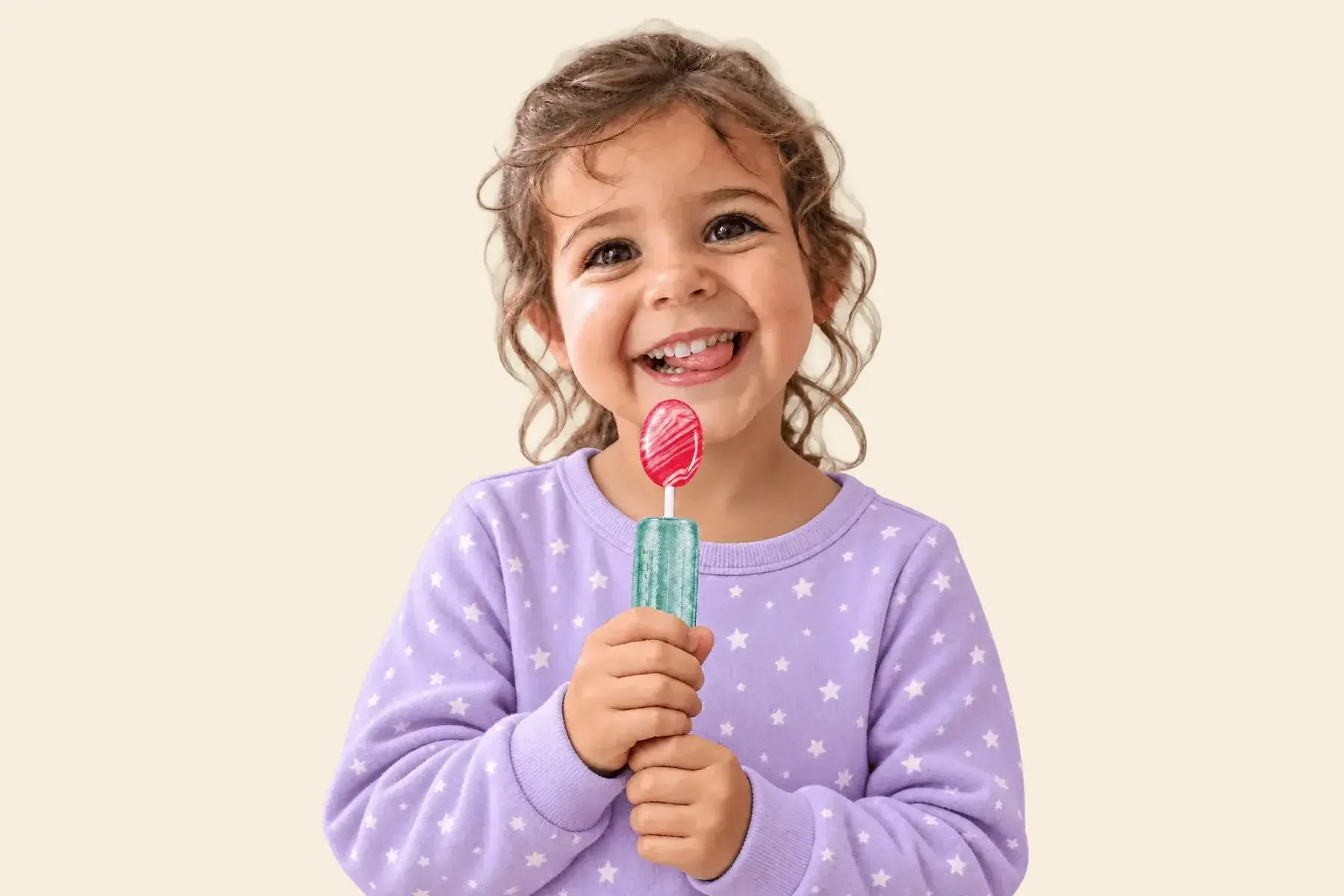A smiling girl in a lilac star sweater holding a Loli-O’s Neb Pop with a red swirl lollipop.